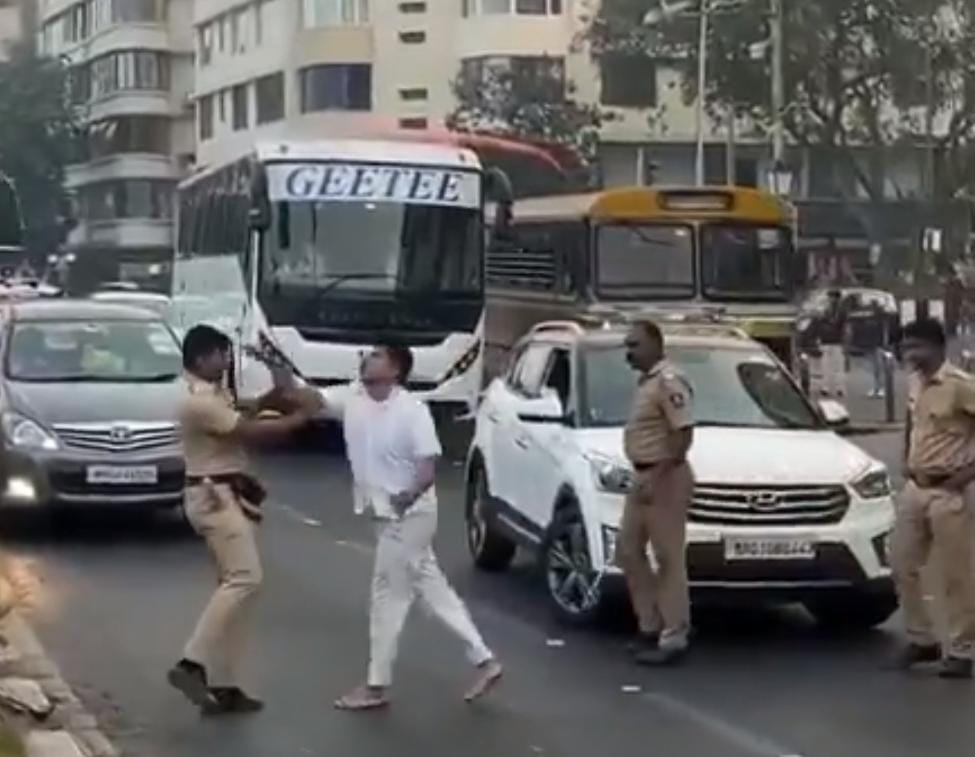 man confronting traffic police personnel on Marine Drive